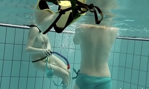 Girls swimming underwater plus loving eachother