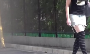 Asian teen pees outdoors